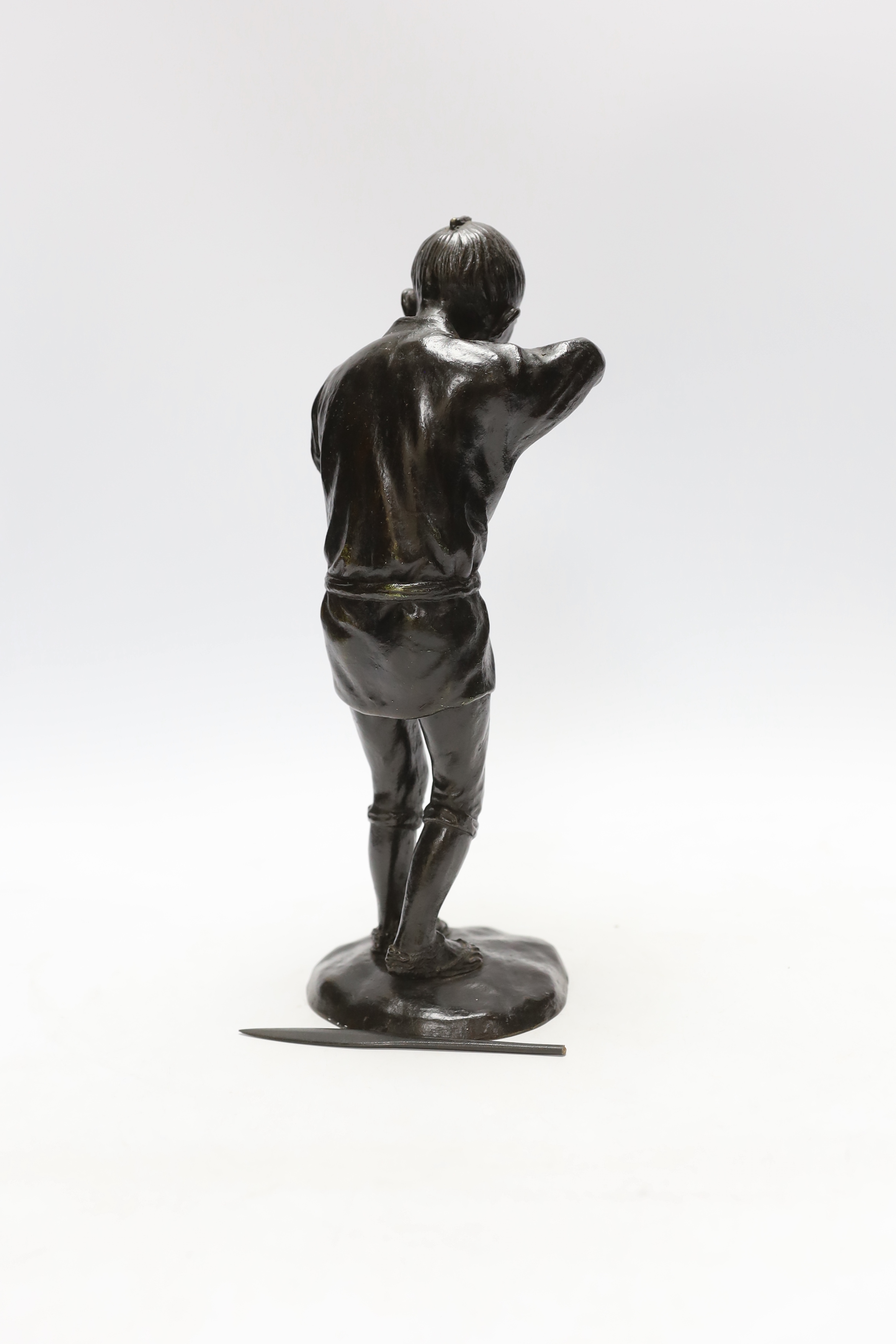 A Japanese Meiji period bronze of a pipe smoker, 29cm high
